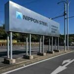 Nippon Steel and U.S. Steel shake hands in front of a steel plan.